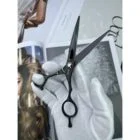 CHITIAN Z-01 black titanium barber shears, side view on display