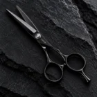 CHITIAN Z-01 black titanium cutting scissors, complete open view on dark stone